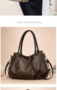 Detail of soft PU leather tote bag with classic monogram print and sturdy top handles