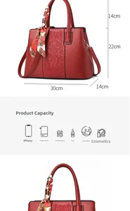 Macro view of wine red embroidered handbag showing size and large interior capacity
