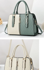 Detail of rhombic embossed PU leather handbag with gold metal zippers and hardware