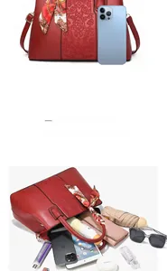 Detail view of red embroidered handbag showing large capacity for essentials like tablets