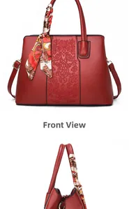 Red embroidered handbag with floral patterns and stylish printed scarf decoration