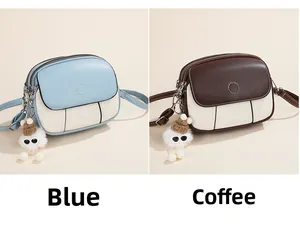 Blue and coffee crossbody bags with contrast panels and cute white plush pendants