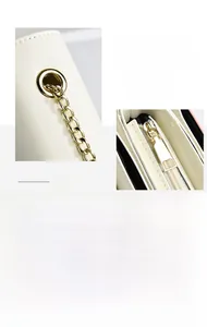 Détail de la chaîne dorée et de la fermeture éclair sur un sac en cuir blanc