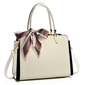 Elegant cream quilted handbag with wave texture and decorative silk scarf detail
