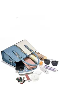 Top view of color-block handbag showing large capacity for iPad, phone, and essentials