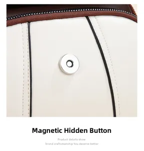Close-up of silver magnetic snap button on premium faux leather handbag detail