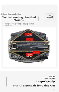 Innenansicht der glänzenden schwarzen Krokoprägung-Tasche mit mehreren Organizer-Fächern