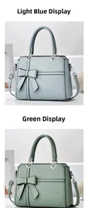 Detail of light blue and green handbags with bow decor and heart shaped metal buckles