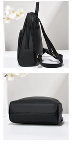 Side and bottom macro views of a black pebbled leather backpack with gold zippers