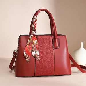 Elegant red leather tote bag with floral embroidery and silk scarf for Mother's Day