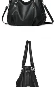Detail view of black lychee grain PU leather tote bag with pleats and metal hardware