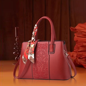 Elegant red embroidered handbag for women with silk scarf handle and adjustable strap