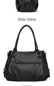 Detail view of black lychee texture leather handbag featuring a rear zipper pocket