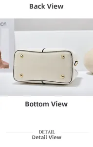 Detail der weißen Handtasche unten mit Goldnieten und Leder in Lychee-Struktur