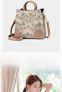 Detail of summer bucket bag featuring Chinese cloud embroidery and metal ring handle