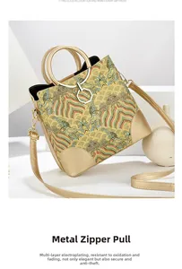 Close-up of premium multi-layer electroplated gold zipper on Chinese style jacquard handbag