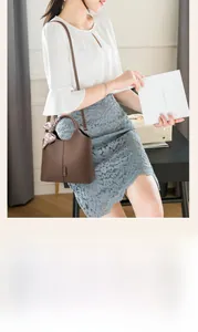 Brown lychee grain leather handbag with decorative silk scarf and adjustable strap