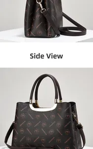 Side view of large vintage printed handbag featuring gold hardware and PU leather straps