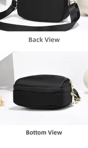 Détail du sac bandoulière en nylon noir montrant l'arrière, le fond et les zips dorés