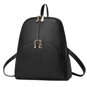 Minimalist black pebbled leather travel backpack with golden zippers and large capacity