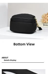 Detailed bottom view of black oxford cloth crossbody bag with quilted stitching