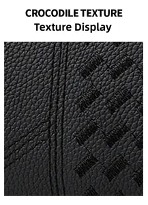 Detailed close-up of the black crocodile embossed texture on a large capacity tote bag