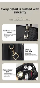 Detail of reinforced handle and golden hardware on black lychee grain handbag
