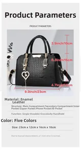 Detailed view of crocodile pattern handbag with dimensions and heart pearl pendant
