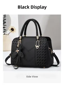 Side view of black large-capacity handbag with V-shaped stitching and golden hardware lock
