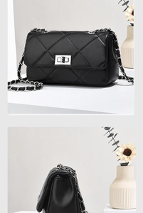 Detail view of black quilted leather mini chain bag with silver twist lock and strap
