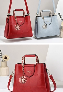 Detailed view of geometric embossed PU leather handbags with elegant flower pendants