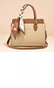 Detail of large color-block tote bag with printed silk scarf on the top handle