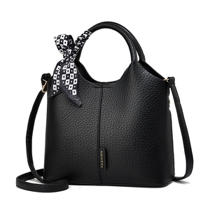 Chic black lychee grain leather tote bag with fashionable checkered silk scarf decor