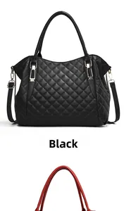 Detail of black quilted soft leather tote with gold hardware and detachable strap
