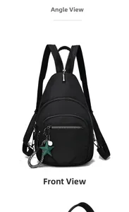 Front view of large capacity black oxford cloth sling bag with green star pendant detail