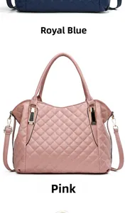 Close-up of quilted soft leather handbags in pink and royal blue with gold hardware