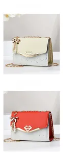 Detail view of small quilted flap bags with heart buckles and pearl bow charms