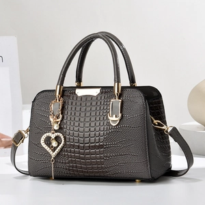 Dark brown crocodile pattern handbag for women with gold hardware and pearl heart charm