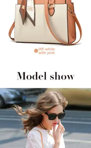 Detail of color-block tote bag with decorative scarf and urban outdoor style shot