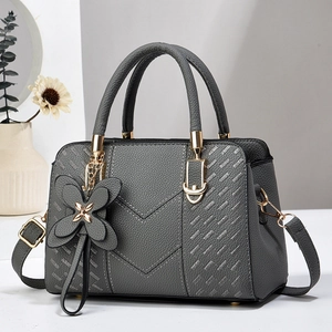 Deep grey litchi leather handbag with V-shaped embroidery and gold hardware accents