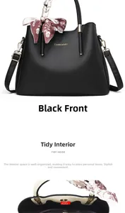 Detail of black pebbled leather tote with inner compartments and elegant silk scarf