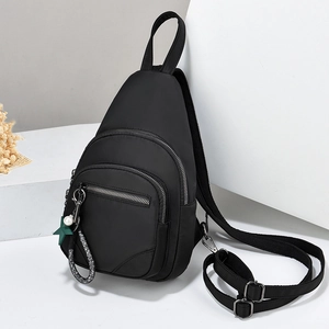 Waterproof black nylon crossbody chest bag with adjustable strap and star pendant