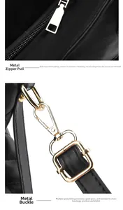 Detail of high-quality gold zipper and adjustable metal buckle on black leather handbag