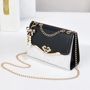 Chic quilted chain bag with black flap and white sequin body with star charms