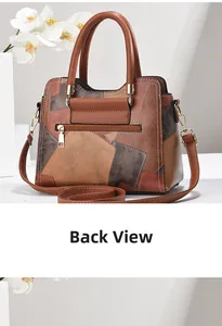 Back view of patchwork leather handbag featuring zipper pocket and light gold hardware