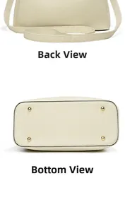 Detailed back view and bottom of cream leather handbag with gold protective metal studs