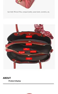 Detail view of red handbag interior showing multiple compartments and spacious storage