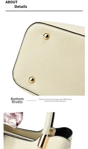 Detailed macro view of ivory leather bag with protective bottom rivets and silk scarf