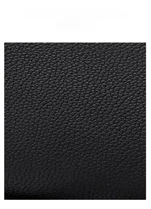 Macro shot of black crocodile embossed texture on high-quality PU leather tote bag