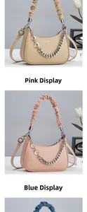 Detail of crescent bags in pink, blue, and beige with ruched handles and gold chains